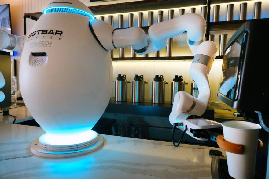 A two-armed robot called "ADAM" prepares a cup of coffee for a customer at Botbar coffee shop on May 31, 2023 in Brooklyn, New York. (Spencer Platt/Getty Images)