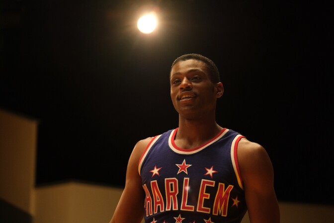 A film still of "Sweetwater" star Everett Osborne in a Harlem Globetrotter jersey. 