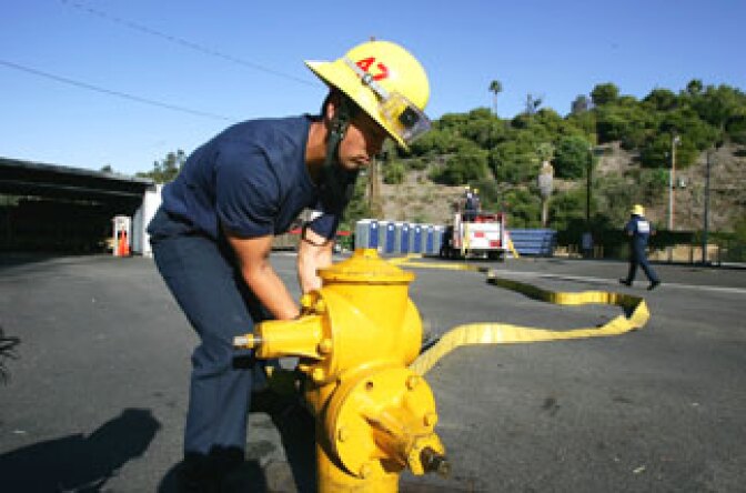 A firefighter recruit practices during training by the Los Angeles Fire Department at the Frank Hotchkin Memorial Training Center Los Angeles, California. File photo.