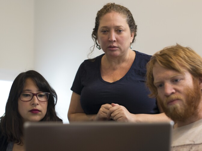 Left to right, Allison Fischer-Olson, Mishuana Goeman and Dean Olson work on the Mapping Indigenous LA website. A team of faculty and student researchers from UCLA are building the website using information gathered from Indigenous communities around LA. 