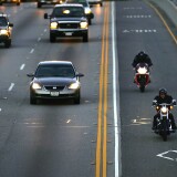 Two motorcyclists drive in the High Occupancy Vehicle (HOV) lane, also called the diamond or commuter lane, on the 118 or Ronald Reagan Freeway on February 3, 2005 near Simi Valley, California.