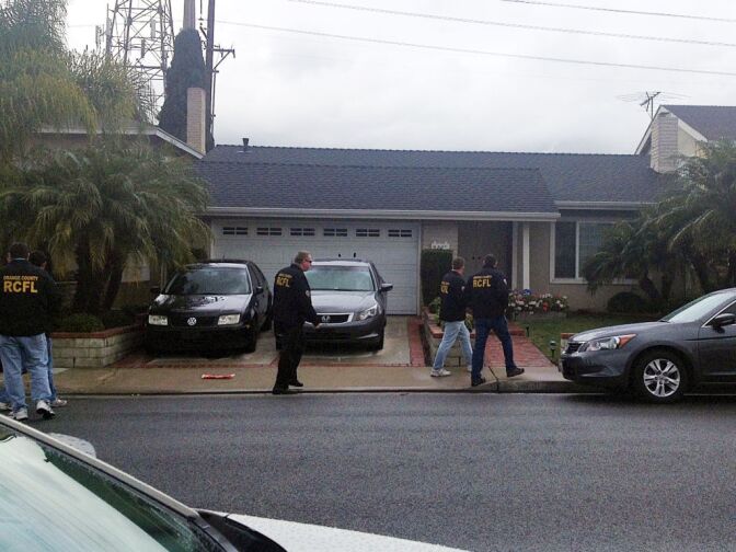 Orange County Regional Computer Forensics Laboratory officers enter Christopher Dorner's La Palma home on Friday morning for a search warrant in connection to a homicide investigation.