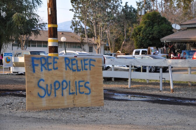 A sign along California Route 150 alerts drivers to the Thomas Fire relief station that's cropped up at Stagecoach Station in Upper Ojai.