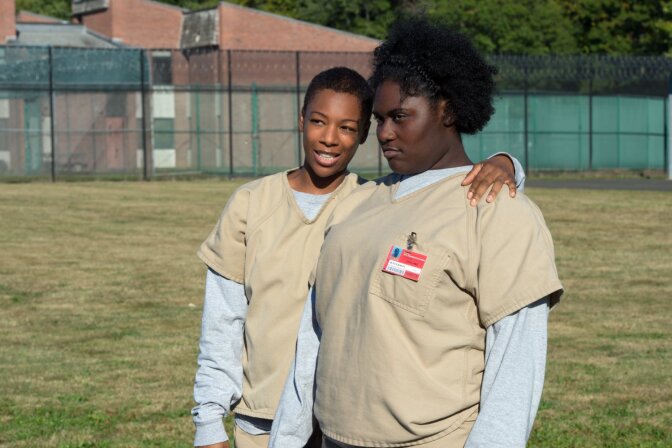 Samira Wiley (L) portrays the gay character Poussey Washington on Netflix's "Orange is the New Black." 