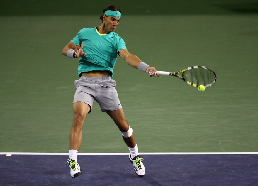 Rafael Nadal of Spain hits a return to Ryan Harrison during day 4 of the BNP Paribas Open at Indian Wells Tennis Garden on March 9, 2013 in Indian Wells, California.