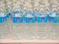Nestle's many products include bottled water.  (Photo by Bryan Bedder/Getty Images for NYCWFF)
