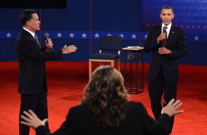 CNN's Candy Crowley (C) conducts the second presidential debate with US President Barack Obama (R) and Republican presidential candidate Mitt Romney (L) at the David Mack Center at Hofstra University in Hempstead, New York, Oct. 16, 2012.