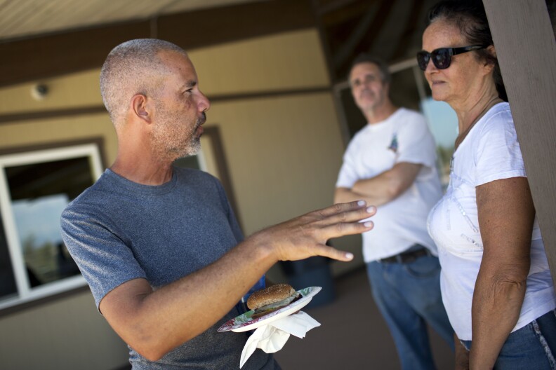 Randy Brown makes a stop for lunch at Vista Del Mar Clubhouse during his six-day walk around the Salton Sea on Friday, June 12, 2015. Brown's father-in-law follows him during the trip with a motor home where Brown and his support team sleep at night.