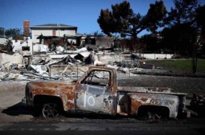 The shell of a truck sits in front of a burned home near the epicenter of the gas line explosion that devastated a neighborhood near San Francisco International Airport on Sept. 24, 2010 in San Bruno, Calif.