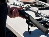 A MAC-12, a blowback-operated machine pistol, with a silencer is turned in at the gun buyback event on Wednesday.