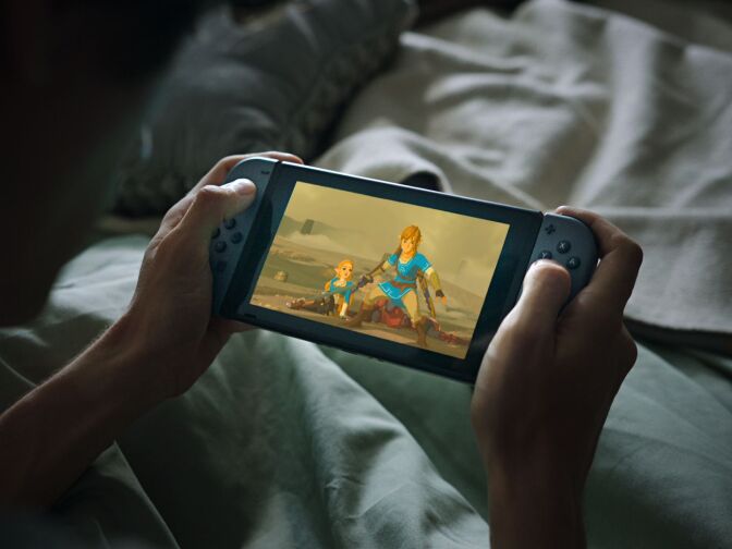 A promotional shot of the Nintendo Switch, a video game console capable of literally being picked up and taken on the move without sacrificing the playing experience.