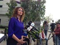 Orange County District Attorney's Office spokeswoman Farrah Emami talks to reporters about rape, lewd acts in a minor charges against Israel Garcia on Thursday, May 22, 2014.