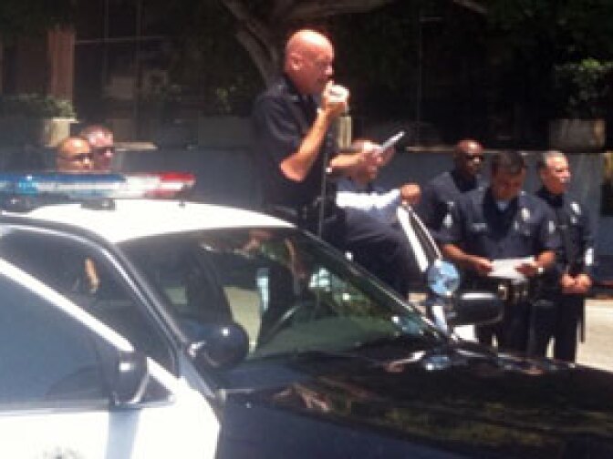 LAPD Incident Commander Andrew Smith issues dispersal orders to immigrant right's supporters gathered at the corner of Wilshire Boulevard and Highland Avenue in L.A., July 29, 2010.