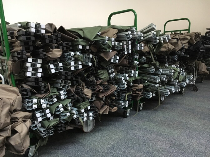 Folded up cots completely line the wall of the chapel at Union Rescue Mission in downtown L.A. At night, the cots are arranged wall-to-wall so the chapel can be used for homeless families to sleep in.