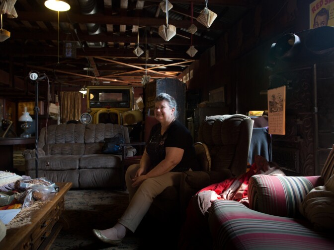 A curator for the Glendora Historical Society helps archive the collection at the Rubel Castle.