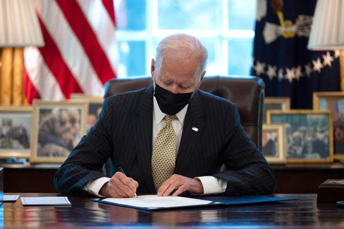 US President Joe Biden signs the Paycheck Protection Program (PPP) Extension Act of 2021 into law at the White House in Washington, DC, on March 30, 2021. (Photo by JIM WATSON / AFP) (Photo by JIM WATSON/AFP via Getty Images)