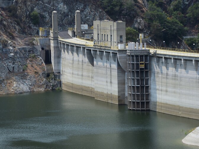 A lowering water level can be seen at Morris Dam, which holds back the San Gabriel River in the San Gabriel Mountains, north of Azusa and east of Los Angeles on July 29, 2014 in California, where emergency water-conservation measures are being implemented as the state struggles through its third year of drought amid lowering water supplies in its reservoirs, parched dry land on farms across the state and a heightened concern for wildfire dangers. New restrictions carrying a $500 penalty come into effect in California on August 1st regarding outdoor water use. 