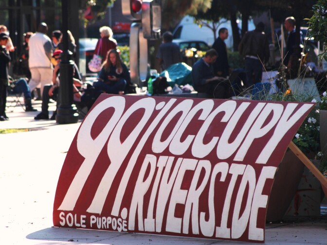 Occupy Riverside protestors defy police orders, returning to the downtown plaza by City Hall one day after Riverside Police Department's raid.