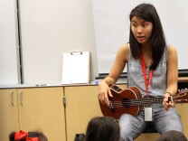 Zoe Kumagai, 23, a new music teacher at Veterans Elementary School in Chula Vista, California, instructs a group of kindergarten students. Kumagai is one of more than 10 first-year teachers hired by the Chula Vista Elementary School District. Due in part to the teacher shortage in California, the district is still trying to hire 16 additional art teachers. 