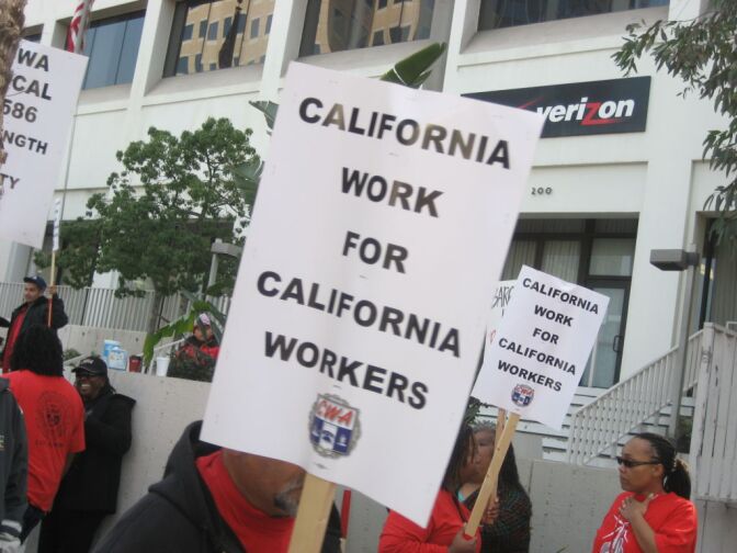 Members of the Communications Workers of America staged a protest rally outside a Verizon call center in Long Beach.