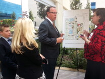 Noah Kemp and his parents Kristen and Derek Kemp checks out the floorplan for the new Children's Hospital of Orange County Pediatric Mental Health Center for kids with Dr. Heather Huszti, chief psychologist at CHOC. The 18 beds at the center will be the first in the county that will be available to kids under 12. Noah is the inspiration for the new center.