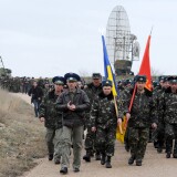 Ukrainian air force pilots march in their air base in Belbek, near Sevastopol, on March 4, 2014. Russian forces surrounding the air base in Belbek fired warning shots at Ukrainian servicemen trying to approach on March 4, a Ukrainian officer inside told AFP. Russian forces have surrounded Ukrainian military bases across Crimea as the Russian-speaking autonomous region has been thrown into turmoil following the ouster last month of Moscow-backed president Viktor Yanukovych. Ukrainian officials said on March 3 that Russia had given Ukrainian soldiers in Crimea an ultimatum to surrender or face an all-out assault, although Russia denounced the claim as 'complete nonsense'.