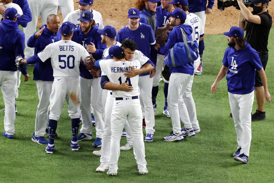 ARLINGTON, TEXAS - OCTOBER 18:  The Los Angeles Dodgers celebrate their 4-3 victory against the Atlanta Braves in Game Seven of the National League Championship Series at Globe Life Field on October 18, 2020 in Arlington, Texas. (Photo by Ron Jenkins/Getty Images)