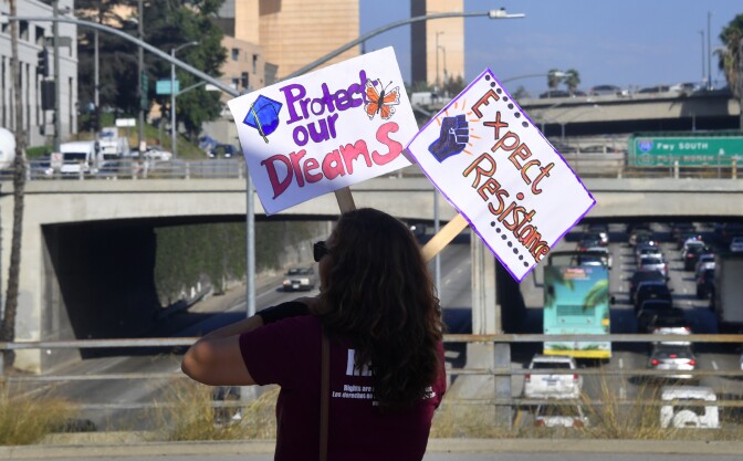 Volunteers from The Coalition for Humane Immigrant Rights (CHIRLA) protest with banners and placards over a freeway in Los Angeles, California on August 28, 2017.
Volunteers protested in support and defense of the Deferred Action for Childhood Arrivals (DACA), the immigration relief program which has represented hope and a lifeline for more than 800,000 young undocumented immigrant men and women. / AFP PHOTO / FREDERIC J. BROWN        (Photo credit should read FREDERIC J. BROWN/AFP/Getty Images)