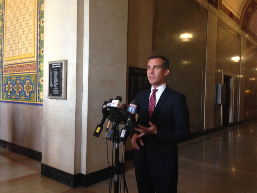 Mayor Eric Garcetti addresses the media outside Council Chamber. 