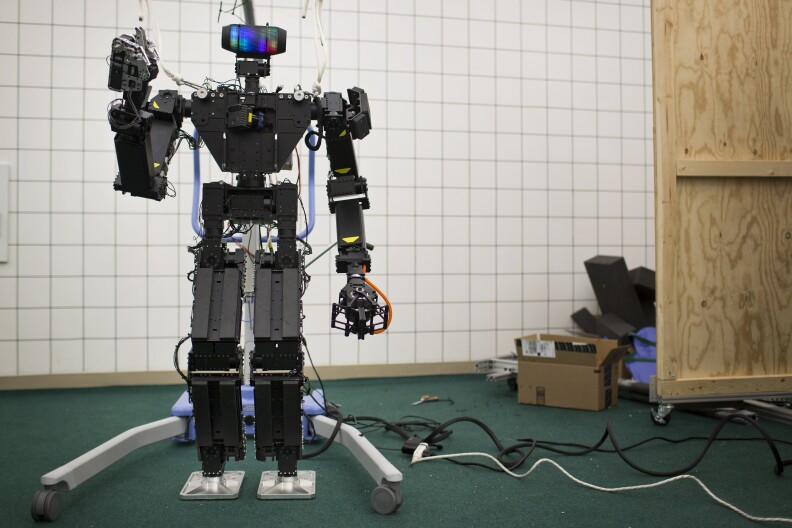 The first generation of THOR stands inside the Robotics and Mechanisms Laboratory at UCLA on Friday morning, May 8, 2015.
