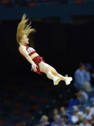 University of Arkansas cheerleaders perform high flying stunts during the SEC Men's Basketball Tournament game between the Louisiana State University Tigers and the University of Arkansas Razorbacks at the Louisiana Superdome on March 13, 2003.