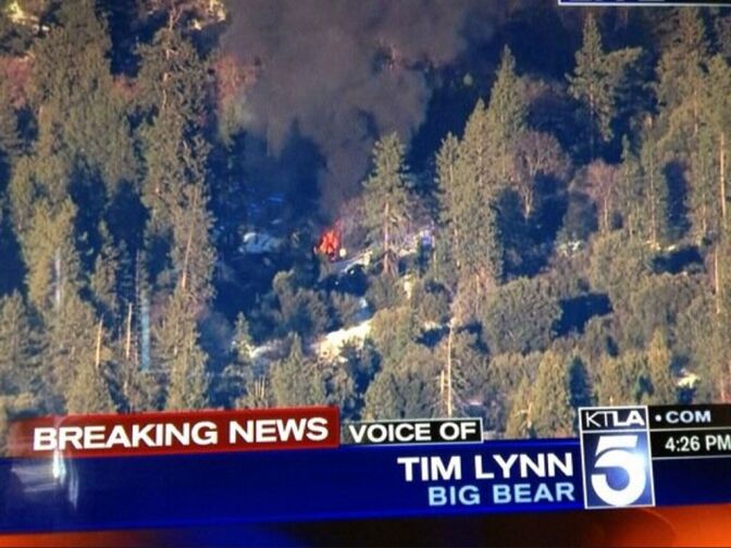 A screenshot showing a cabin on fire near Big Bear where police surrounded a man they believe to be murder suspect Christopher Dorner following two gun battles on Feb. 12, 2013. A deputy was killed in one of the battles.