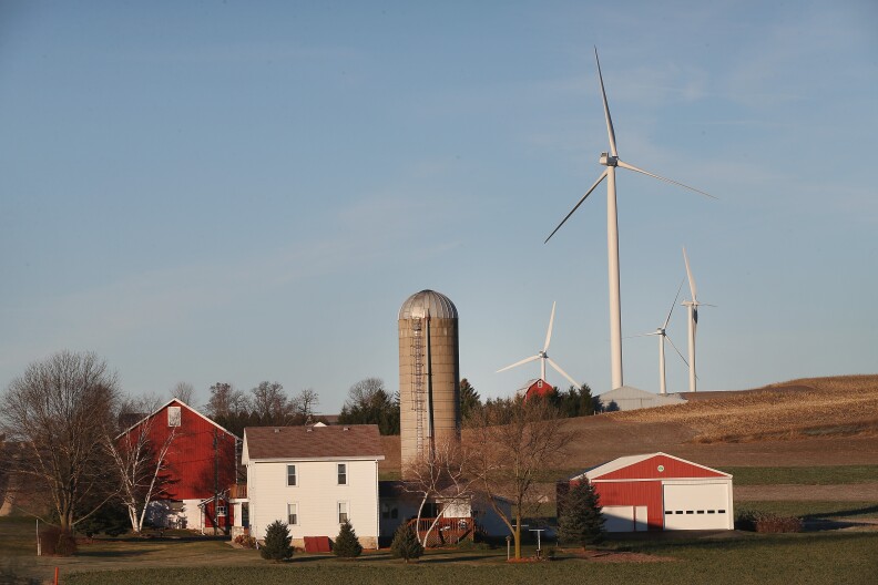 MIDDLETON, WI - NOVEMBER 19:  Wind turbines rise up above farmland on the outskirts of the state capital on November 19, 2013 near Middleton, Wisconsin. A bill that would make it easier for residents living near power generating wind turbines to sue for any perceived negative impacts to their health and property values goes before the Wisconsin legislature on Wednesday. Critics believe the bill (SB167) could kill the wind energy business in Wisconsin.  (Photo by Scott Olson/Getty Images)