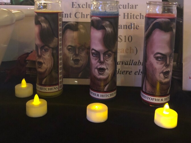 Caption: Votive candles for “secular saints” like 'author and social critic Christopher Hitchens were on display at the first 'Secular Day of the Dead' in Los Angeles. (Photo by Aaron Schrank/LAist)
 
