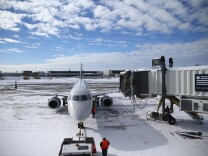 BOSTON, MA - JANUARY 28: A plane taxis into its gate at Logan International Airport after the area was hit by Winter Storm Juno on January 28, 2015 in Boston, Massachusetts. Boston, and the rest of New England, picked up over two feet of snow from the storm. (Photo by Maddie Meyer/Getty Images)
