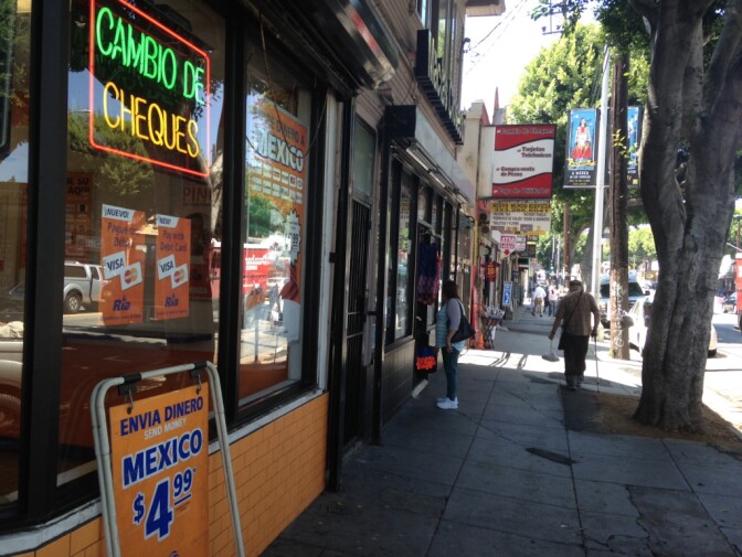 Money wiring businesses on Cesar Chavez Avenue in Los Angeles' Boyle Heights. As the Mexican peso drops, immigrants in the U.S. hope the dollars they send home will help relatives.