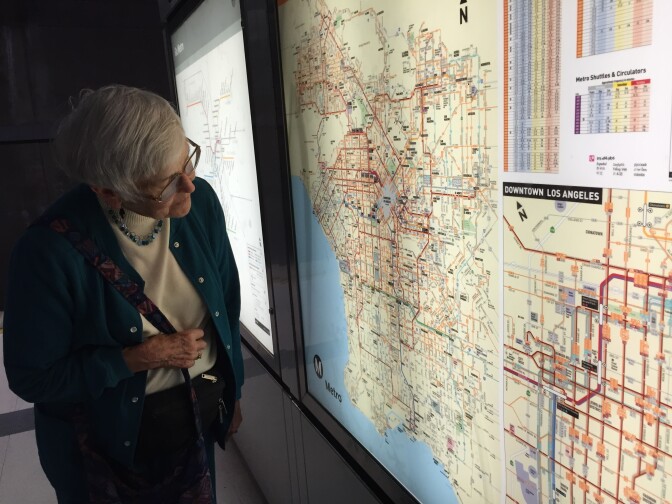 Grace Moreman, 85, checks the subway map in a station of the Metro Red Line in downtown L.A. 