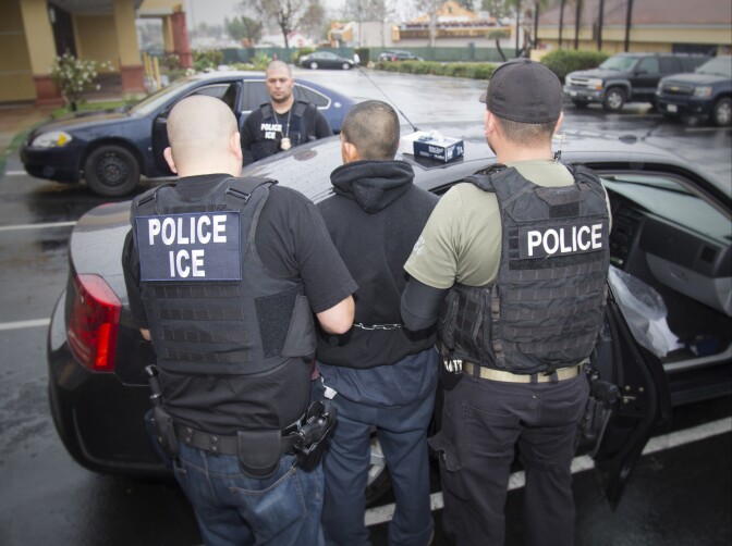 In this Tuesday, Feb. 7, 2017, photo released by U.S. Immigration and Customs Enforcement shows foreign nationals being arrested during a targeted enforcement operation conducted by U.S. Immigration and Customs Enforcement (ICE) aimed at immigration fugitives, re-entrants and at-large criminal aliens in Los Angeles.