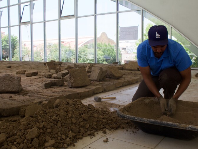 Rafa Esparza puts together the final bricks for "Tierra," his piece at the Hammer Museum's "Made in LA" biennial.
