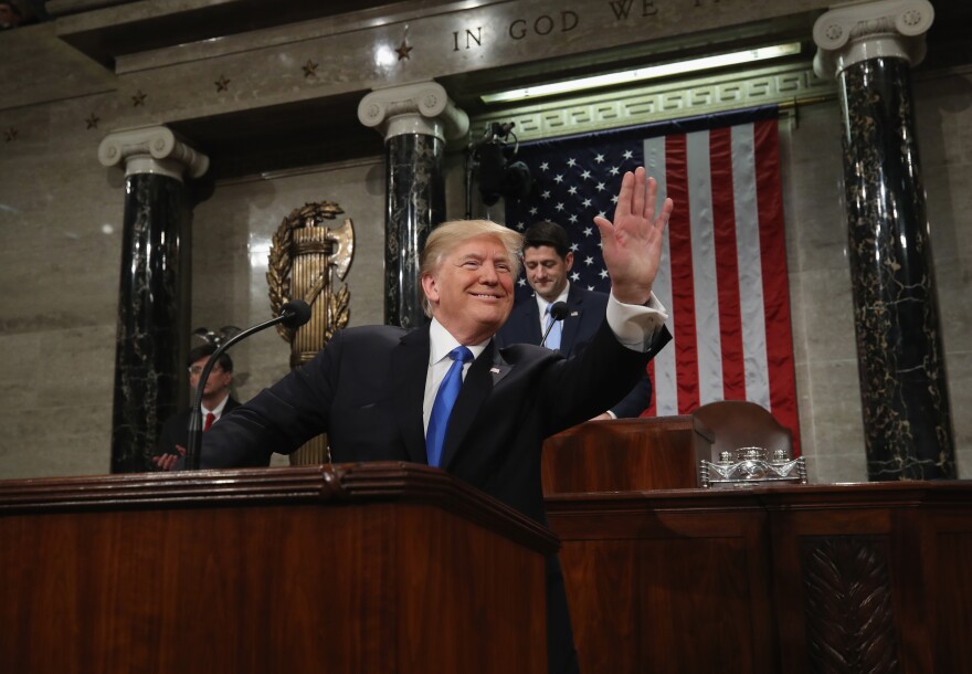 File: President Donald J. Trump waves as he arrives during the State of the Union address in the chamber of the U.S. House of Representatives on Jan. 30, 2018 in Washington, D.C. This is the first State of the Union address given by U.S. President Donald Trump and his second joint-session address to Congress.