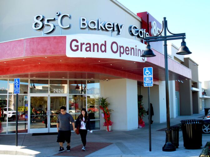 WEST COVINA, Calif. -- Customers emerge from the storefront at the new 85°C Bakery Cafe on Jan. 16. This company-owned West Covina location is the third to open in the United States, with more openings planned throughout Southern California. The Taiwan-based chain, while new to the U.S. market, operates more than 700 stores worldwide.