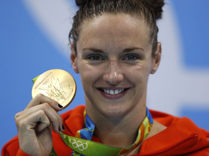 TOPSHOT - Hungary's Katinka Hosszu poses with her gold medal on the podium after she won the Women's 200m Individual Medley Final during the swimming event at the Rio 2016 Olympic Games at the Olympic Aquatics Stadium in Rio de Janeiro on August 9, 2016.   / AFP / Odd Andersen        (Photo credit should read ODD ANDERSEN/AFP/Getty Images)