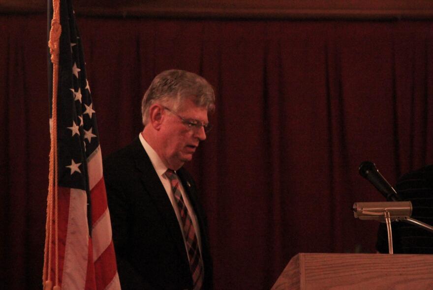 San Bernardino city attorney James Penman takes the podium Wednesday night at a town hall meeting on the city's fiscal crisis. 