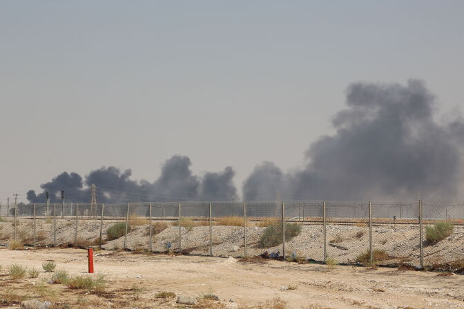 Smoke billows from an Aramco oil facility in Abqaiq about 60km (37 miles) southwest of Dhahran in Saudi Arabia's eastern province on September 14, 2019. - Drone attacks sparked fires at two Saudi Aramco oil facilities early today, the interior ministry said, in the latest assault on the state-owned energy giant as it prepares for a much-anticipated stock listing. Yemen's Iran-aligned Huthi rebels claimed the drone attacks, according to the group's Al-Masirah television. (Photo by - / AFP)        (Photo credit should read -/AFP/Getty Images)