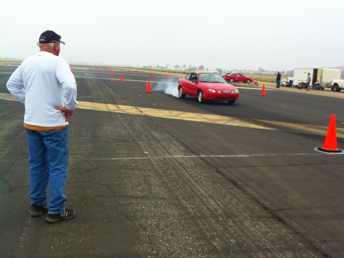 Jim Wilkey supervises student stunt drivers at a stunt driving school at the Camarillo Airport. 
