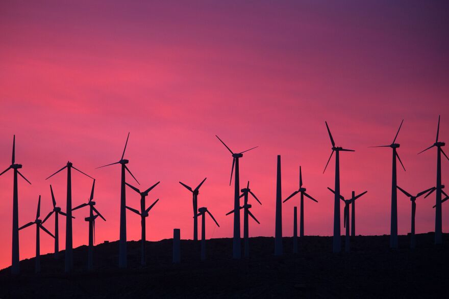 TOPSHOT - Electric energy generating wind turbines are seen on a wind farm in the San Gorgonio Pass area on Earth Day, April 22, 2016, near Palm Springs, California. 
San Gorgonio Pass is one of the largest wind farm areas in the United States.  / AFP / David McNew        (Photo credit should read DAVID MCNEW/AFP/Getty Images)