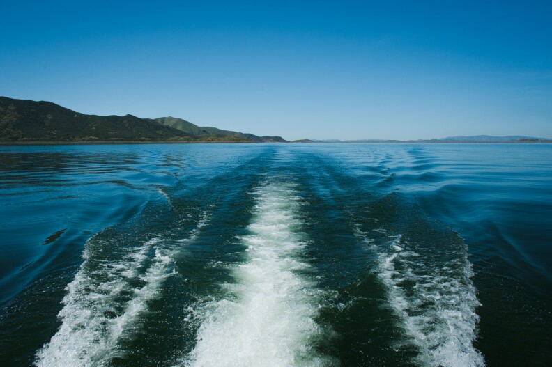 A wake trails behind a boat on Diamond Valley Lake in Hemet, California on March 30, 2017. The amount of water in the reservoir, which is fed by snowmelt from the Sierra Nevadas hundreds of miles away, has doubled in the last year.