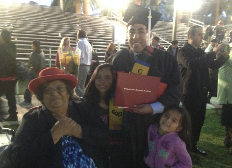 Lionel Mares, standing, with his mother, Maria Angelica Mares, and the children of family friends at his graduation from Cal State Northridge. His mother passed away in 2020.