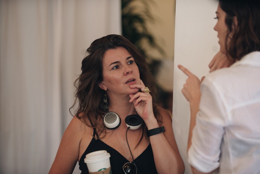 Writer/director Eva Vives (left) talks to actress Mary Elizabeth Winstead on the set of her film, "All About Nina."