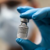 BETHESDA, MARYLAND - DECEMBER 14: SPC Angel Laureano holds a COVID-19 vaccine at the Walter Reed National Military Medical Center on December 14, 2020 in Bethesda, Maryland. Acting Secretary of Defense Christopher Miller received his first shot of the Pfizer-BioNTech COVID-19 vaccine, as the biggest vaccination campaign in U.S. history kicked off in an effort to get protection against the COVID-19 pandemic. (Photo by Manuel Balce Ceneta-Pool/Getty Images)